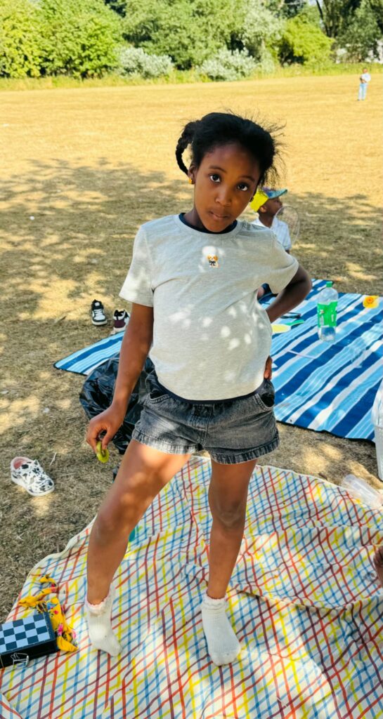 Playing on a picnic blanket in the park