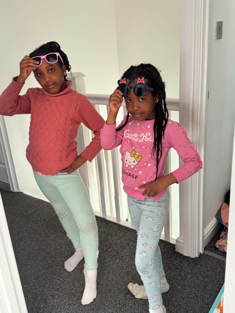 Matching pink outfits and sunglasses